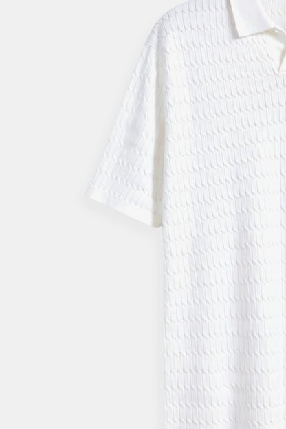 Polo en tricot blanc avec motif texturé