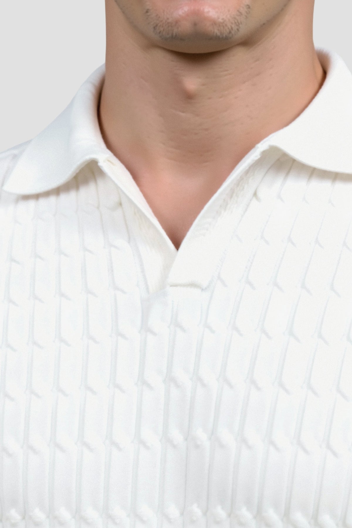 Polo en tricot blanc avec motif texturé