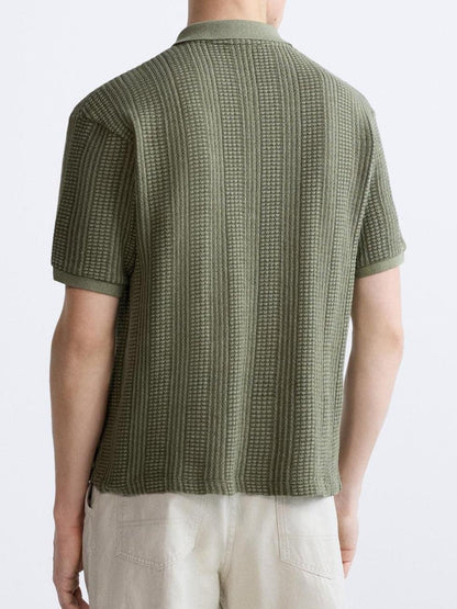 Polo structuré en tricot avec fermeture éclair